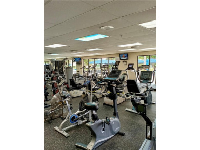 Enjoy stunning golf course and lake views from this bright