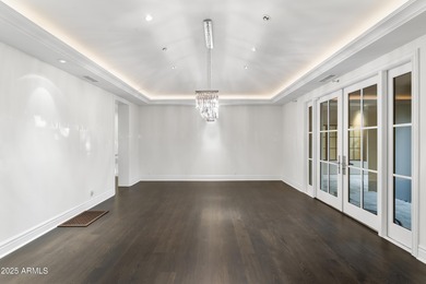 Welcome to 10163 E. Hualapai Drive, a timeless estate nestled in