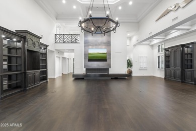 Welcome to 10163 E. Hualapai Drive, a timeless estate nestled in