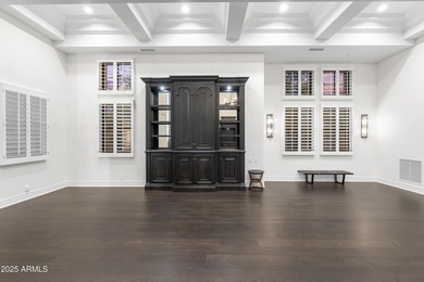 Welcome to 10163 E. Hualapai Drive, a timeless estate nestled in