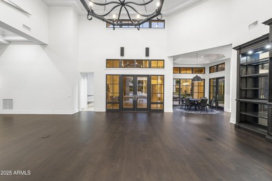 Welcome to 10163 E. Hualapai Drive, a timeless estate nestled in