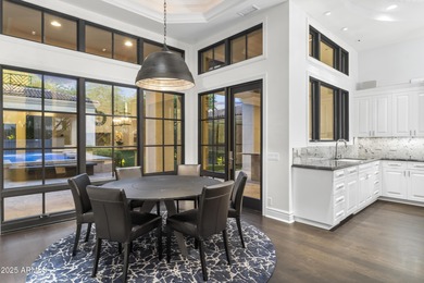 Welcome to 10163 E. Hualapai Drive, a timeless estate nestled in