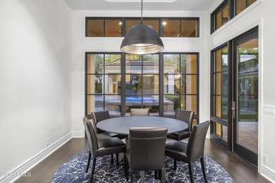 Welcome to 10163 E. Hualapai Drive, a timeless estate nestled in