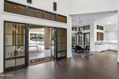 Welcome to 10163 E. Hualapai Drive, a timeless estate nestled in