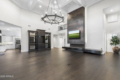 Welcome to 10163 E. Hualapai Drive, a timeless estate nestled in