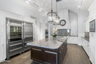 Welcome to 10163 E. Hualapai Drive, a timeless estate nestled in