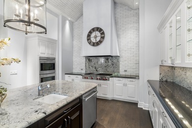 Welcome to 10163 E. Hualapai Drive, a timeless estate nestled in