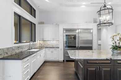 Welcome to 10163 E. Hualapai Drive, a timeless estate nestled in