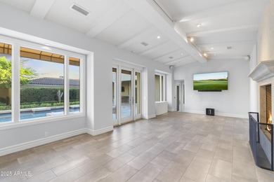 Welcome to 10163 E. Hualapai Drive, a timeless estate nestled in