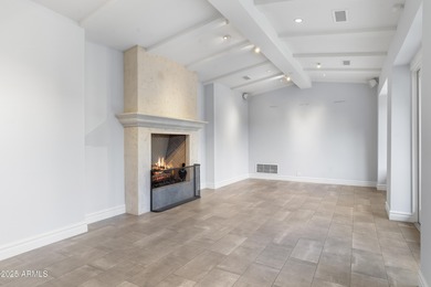 Welcome to 10163 E. Hualapai Drive, a timeless estate nestled in