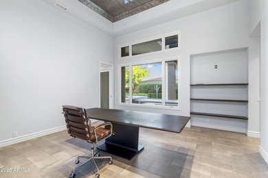 Welcome to 10163 E. Hualapai Drive, a timeless estate nestled in