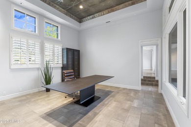 Welcome to 10163 E. Hualapai Drive, a timeless estate nestled in