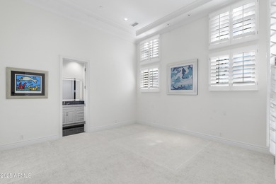 Welcome to 10163 E. Hualapai Drive, a timeless estate nestled in