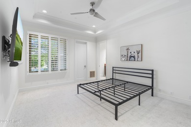 Welcome to 10163 E. Hualapai Drive, a timeless estate nestled in