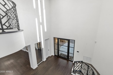 Welcome to 10163 E. Hualapai Drive, a timeless estate nestled in