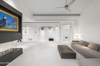 Welcome to 10163 E. Hualapai Drive, a timeless estate nestled in