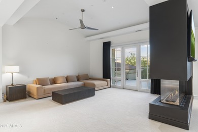 Welcome to 10163 E. Hualapai Drive, a timeless estate nestled in