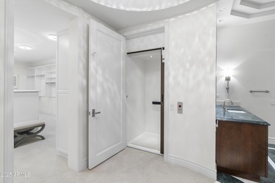 Welcome to 10163 E. Hualapai Drive, a timeless estate nestled in