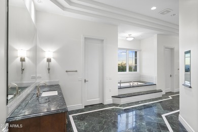 Welcome to 10163 E. Hualapai Drive, a timeless estate nestled in