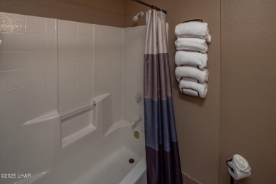 Desirable View Condo at Queensbay! This stunning lake-view condo