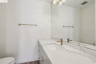 Breathtaking lake views from this bright, impeccably maintained