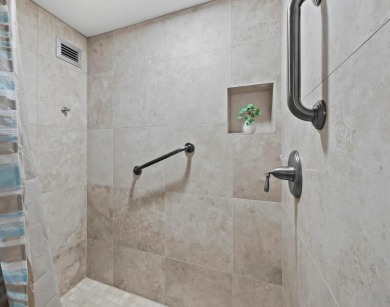 This inviting residence at the Islander Club of Longboat Key