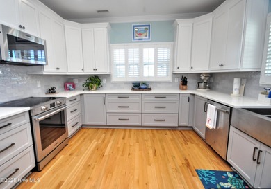 This beautifully custom-built 5-bedroom, 4.5-bath deep water