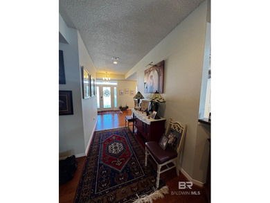 Welcome this charming coastal retreat with salt water pool in