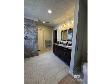 Welcome this charming coastal retreat with salt water pool in