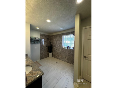 Welcome this charming coastal retreat with salt water pool in