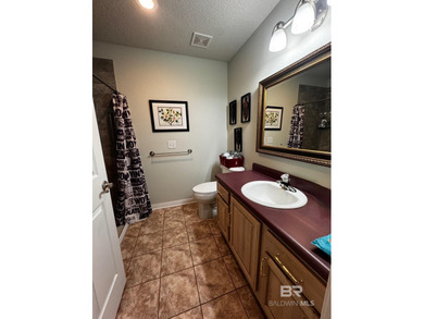 Welcome this charming coastal retreat with salt water pool in