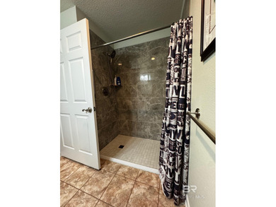 Welcome this charming coastal retreat with salt water pool in