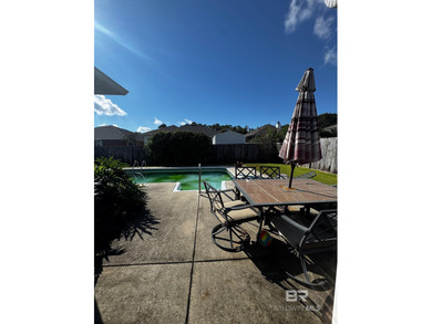 Welcome this charming coastal retreat with salt water pool in