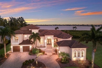DIRECT BAYFRONT CUSTOM BUILT HOME IN GATED PALMA SOLA POINTE!
