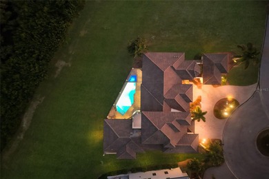 DIRECT BAYFRONT CUSTOM BUILT HOME IN GATED PALMA SOLA POINTE!