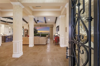 DIRECT BAYFRONT CUSTOM BUILT HOME IN GATED PALMA SOLA POINTE!