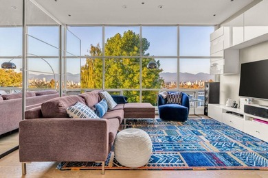 Stunning downtown, mountain, and English Bay views from this