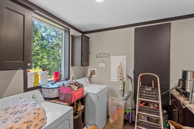 Escape to your own private retreat on over an acre of wooded