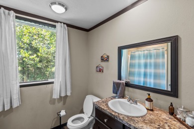 Escape to your own private retreat on over an acre of wooded