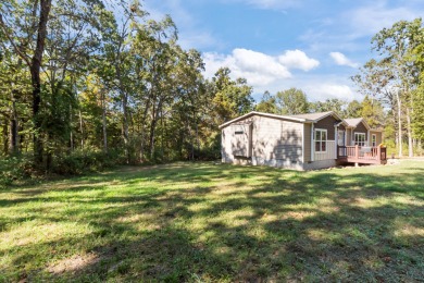Escape to your own private retreat on over an acre of wooded