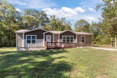 Escape to your own private retreat on over an acre of wooded