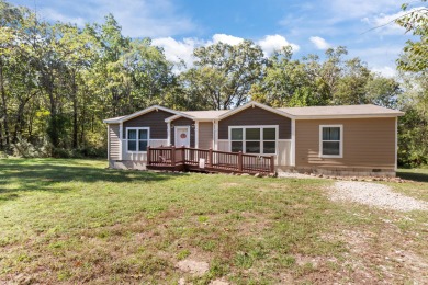 Escape to your own private retreat on over an acre of wooded