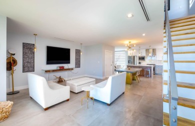 Oceanfront living, elevated. Enjoy expansive, protected views