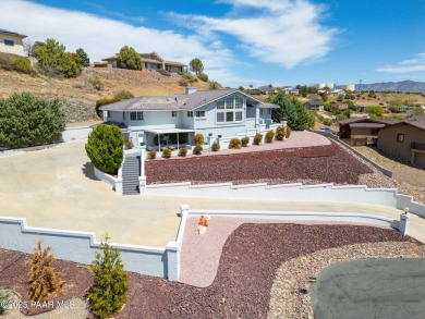 Beautiful split-level ranch perched atop a hill in a serene and