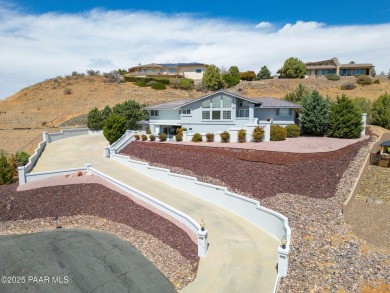 Beautiful split-level ranch perched atop a hill in a serene and