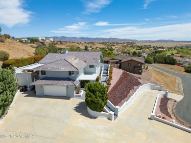 Beautiful split-level ranch perched atop a hill in a serene and