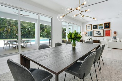 Set on a rare, oversized 56,192 SF lot in one of Coral Gables'