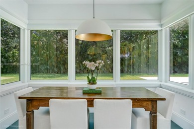 Set on a rare, oversized 56,192 SF lot in one of Coral Gables'