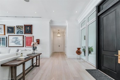 Set on a rare, oversized 56,192 SF lot in one of Coral Gables'