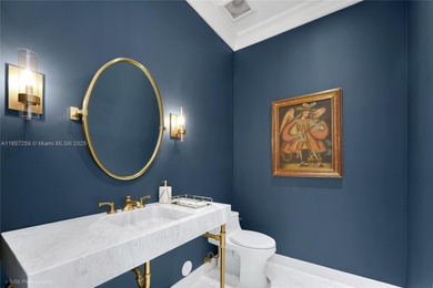 Set on a rare, oversized 56,192 SF lot in one of Coral Gables'